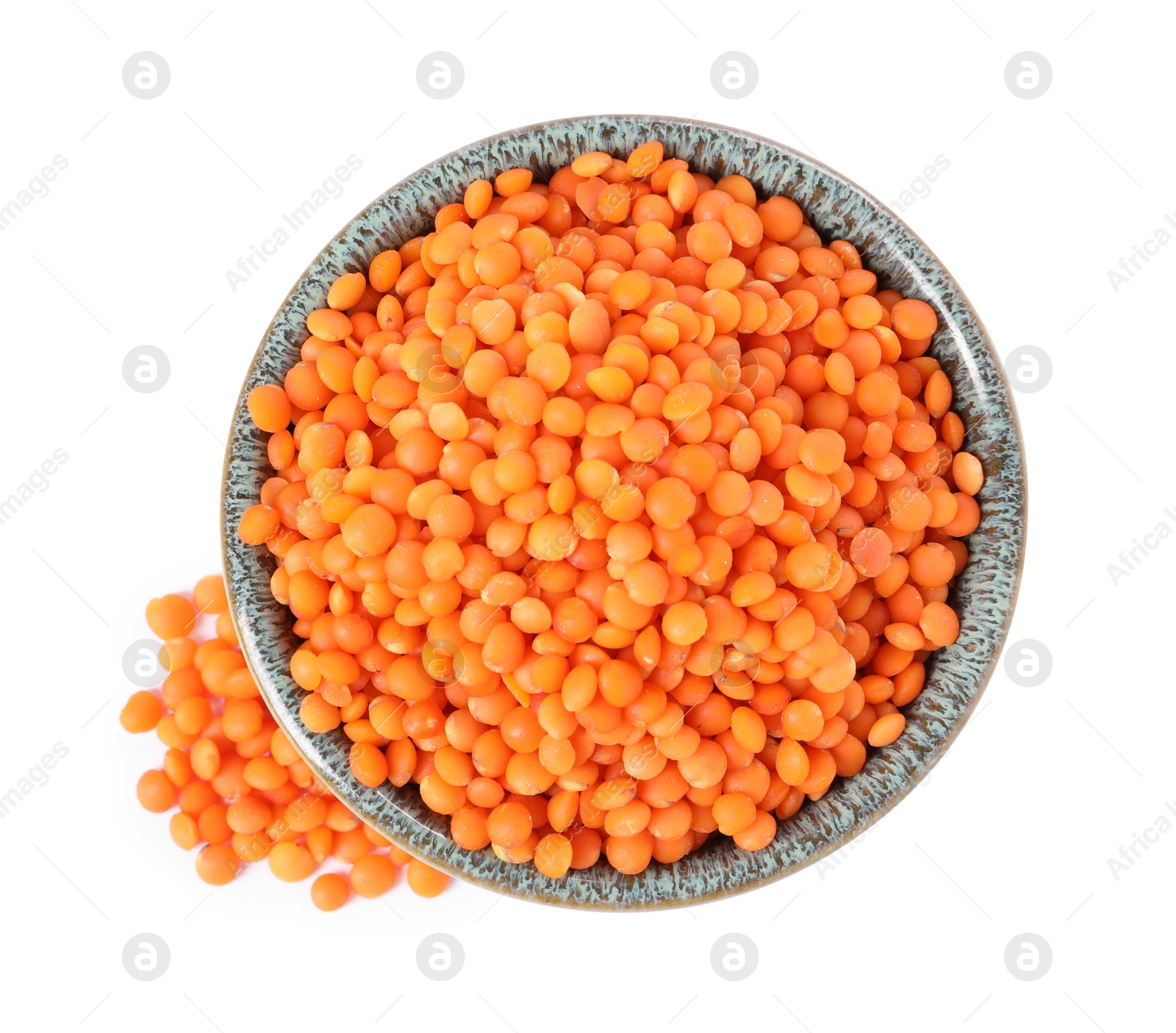 Photo of Raw lentils in bowl isolated on white, top view