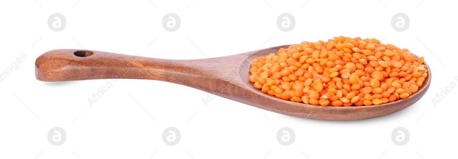 Photo of Raw lentils in spoon isolated on white