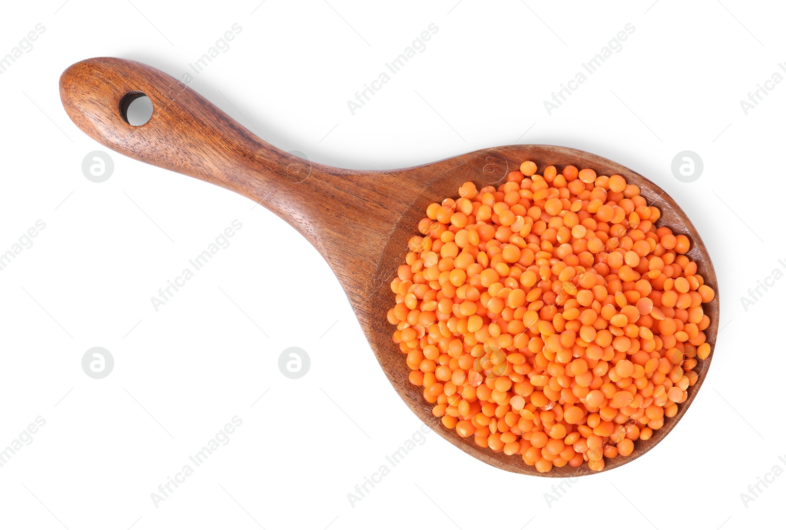 Photo of Raw lentils in spoon isolated on white, top view