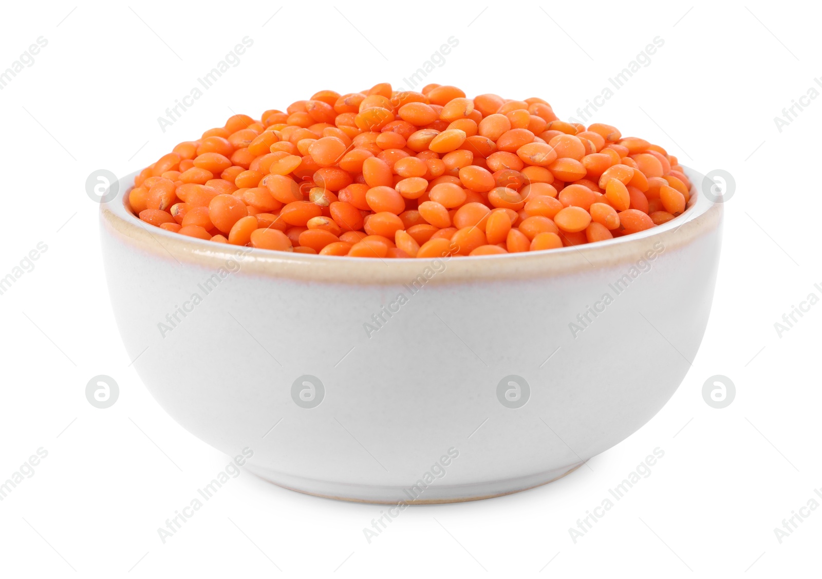 Photo of Raw lentils in bowl isolated on white