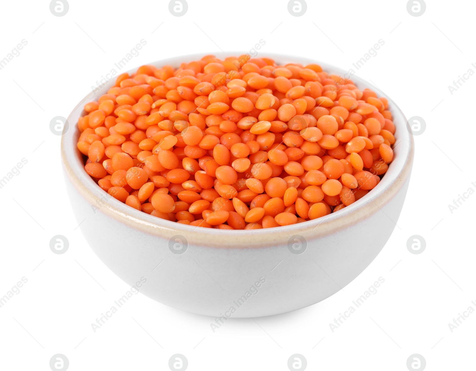 Photo of Raw lentils in bowl isolated on white