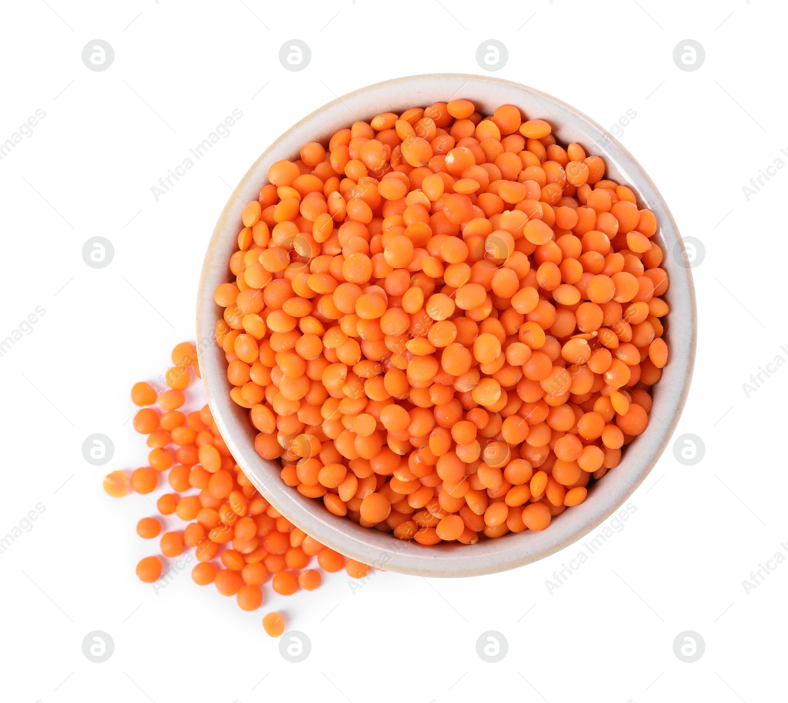 Photo of Raw lentils in bowl isolated on white, top view