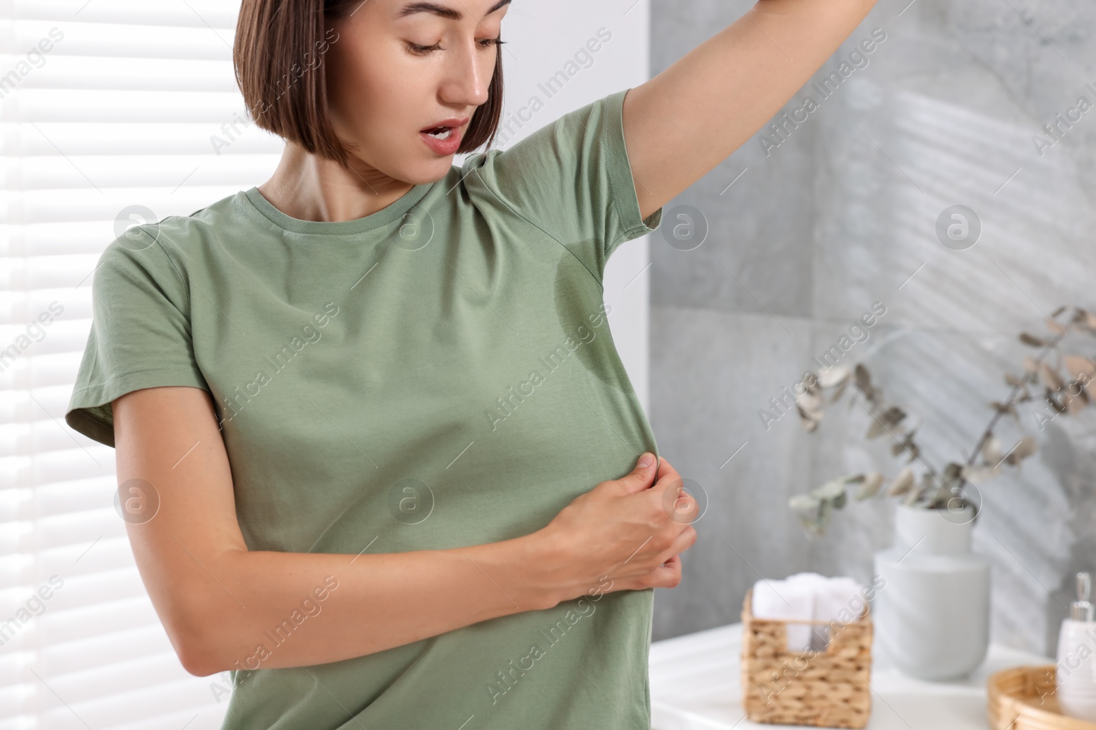 Photo of Woman before using deodorant at home, closeup