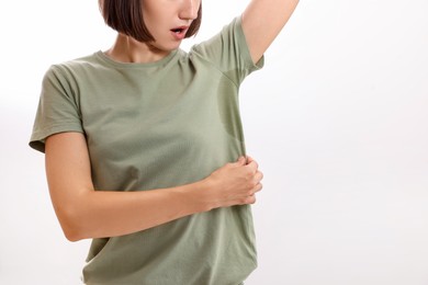 Photo of Woman before using deodorant on white background, closeup