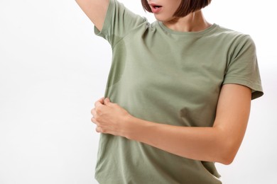 Photo of Woman before using deodorant on white background, closeup