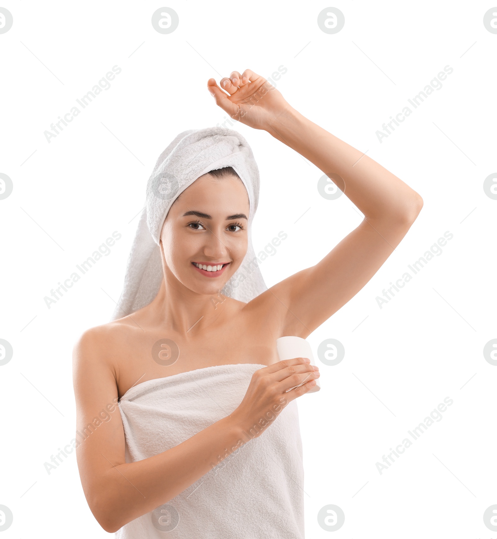 Photo of Smiling woman applying solid deodorant on white background