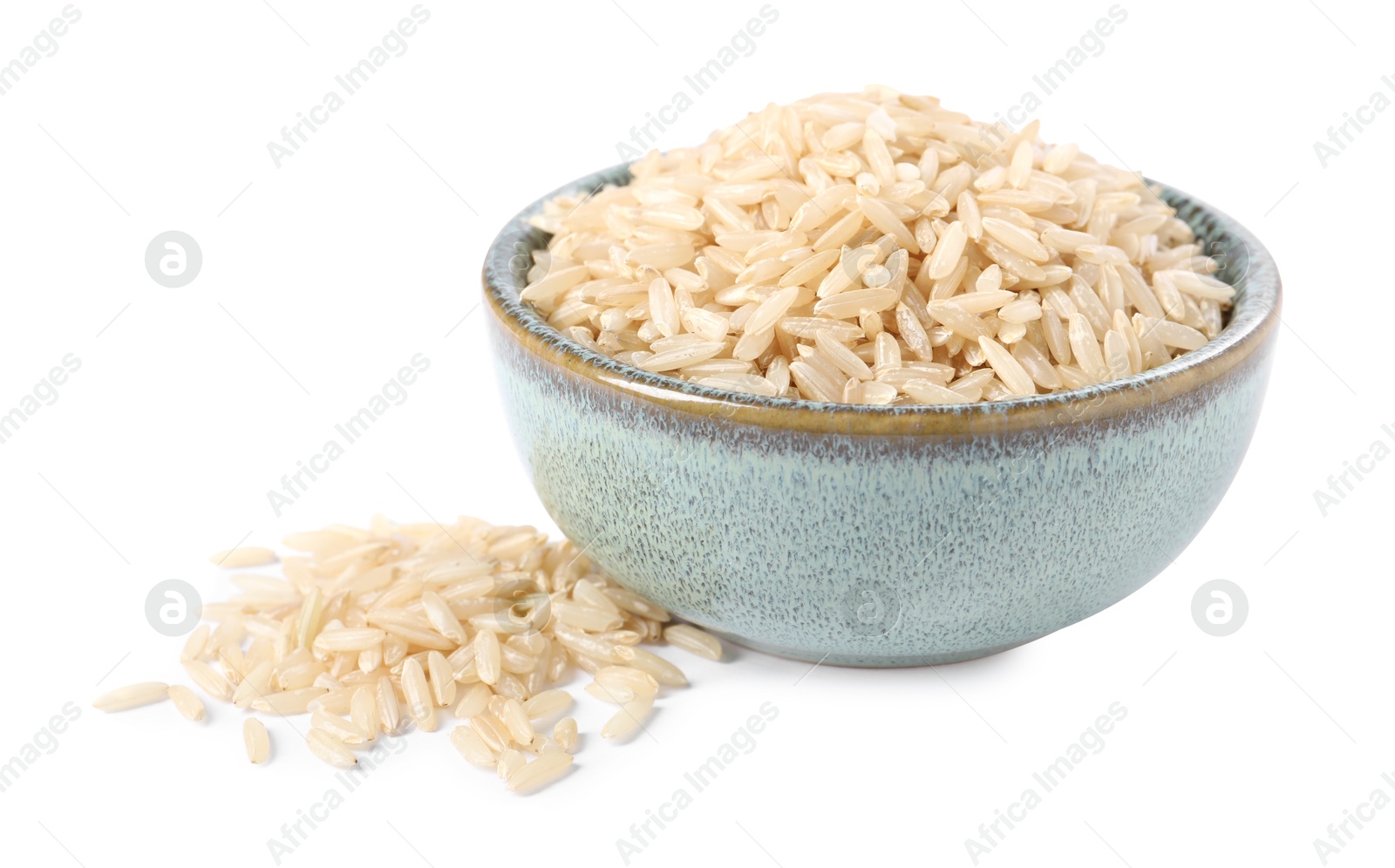 Photo of Raw rice in bowl isolated on white