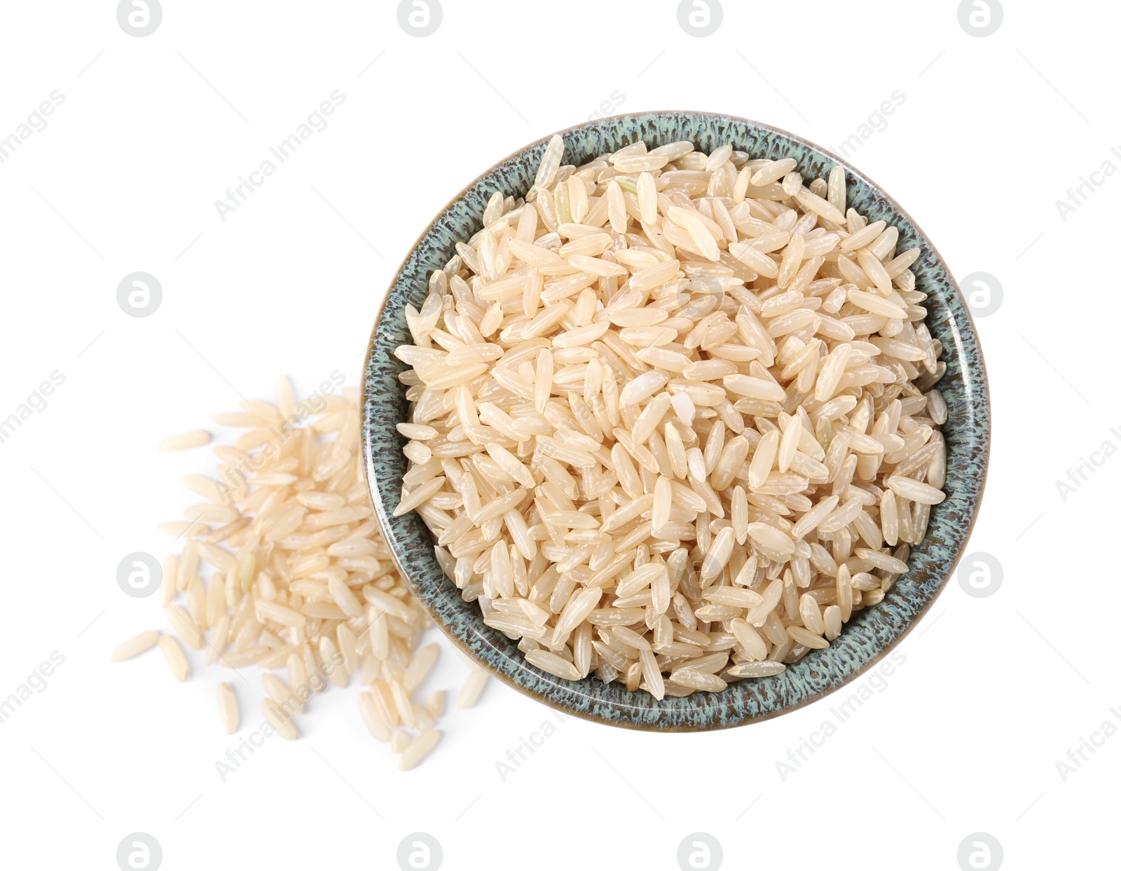 Photo of Raw rice in bowl isolated on white, top view