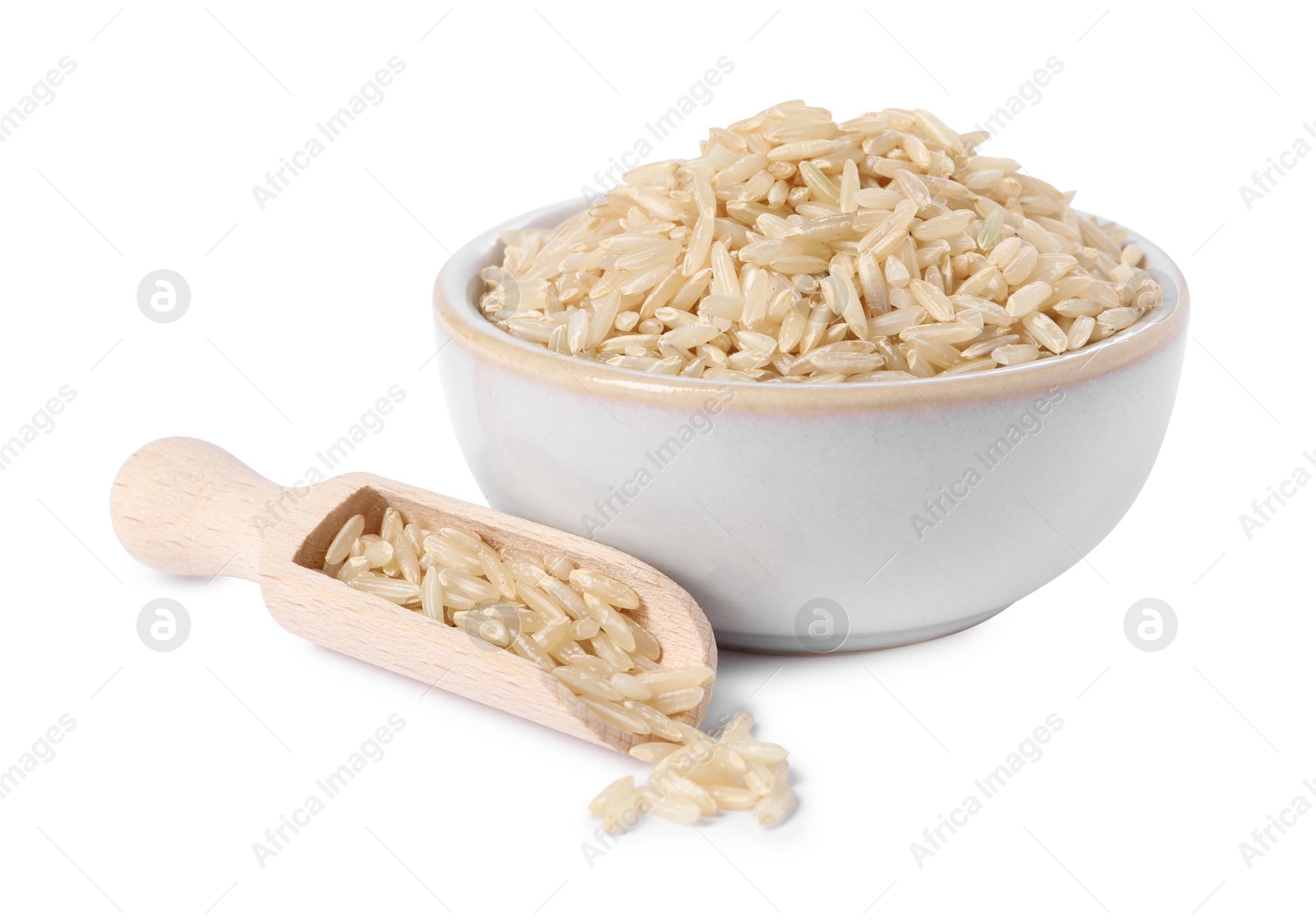 Photo of Raw rice in bowl and scoop isolated on white