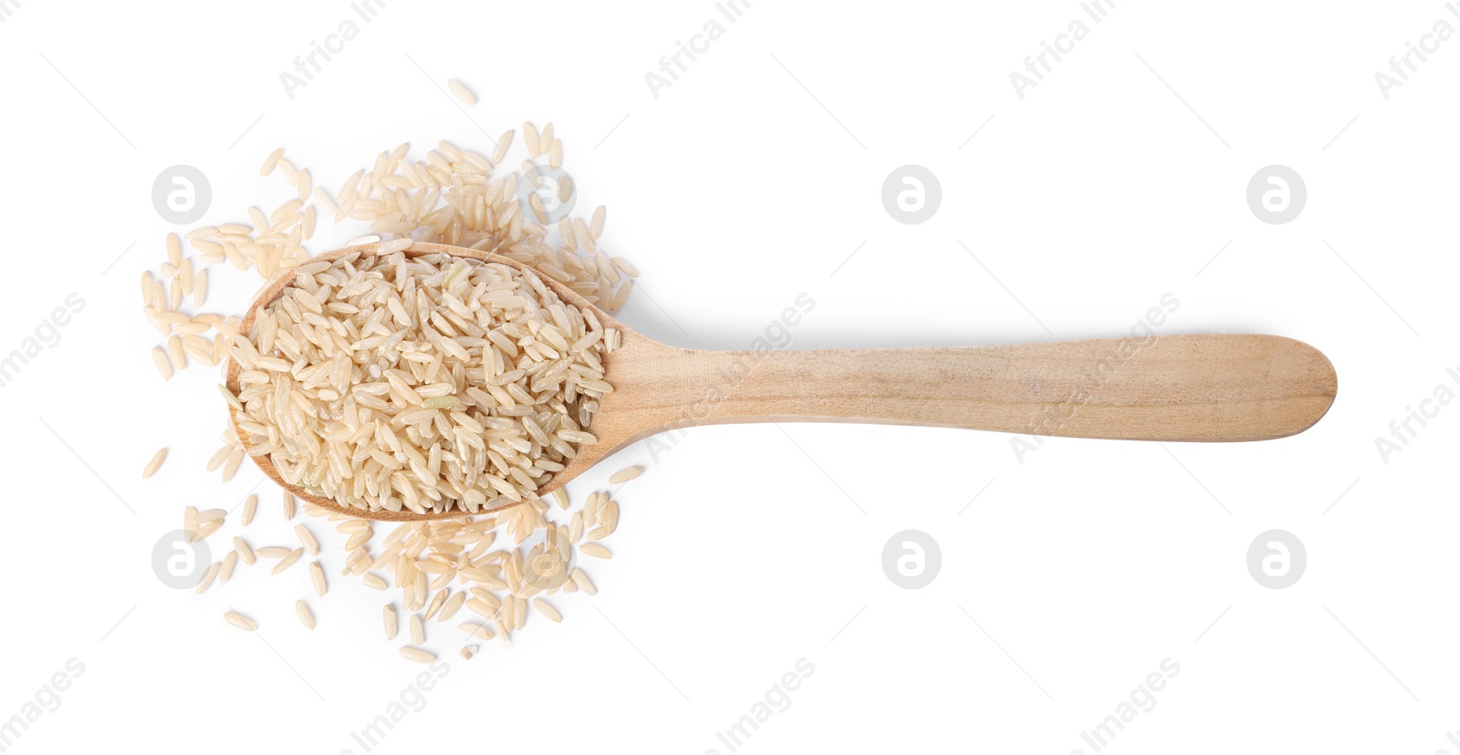 Photo of Raw rice in wooden spoon isolated on white, top view