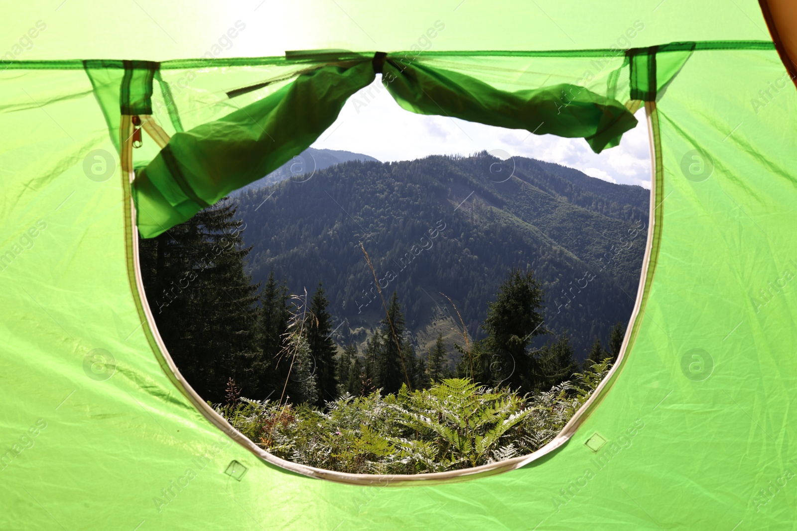 Photo of Beautiful view of mountains through camping tent window