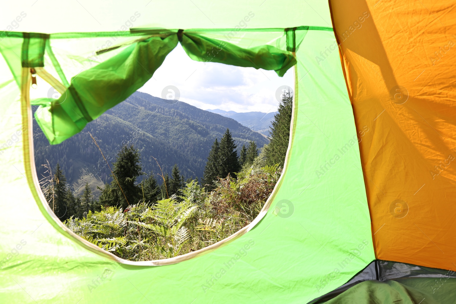 Photo of Beautiful view of mountains through camping tent window