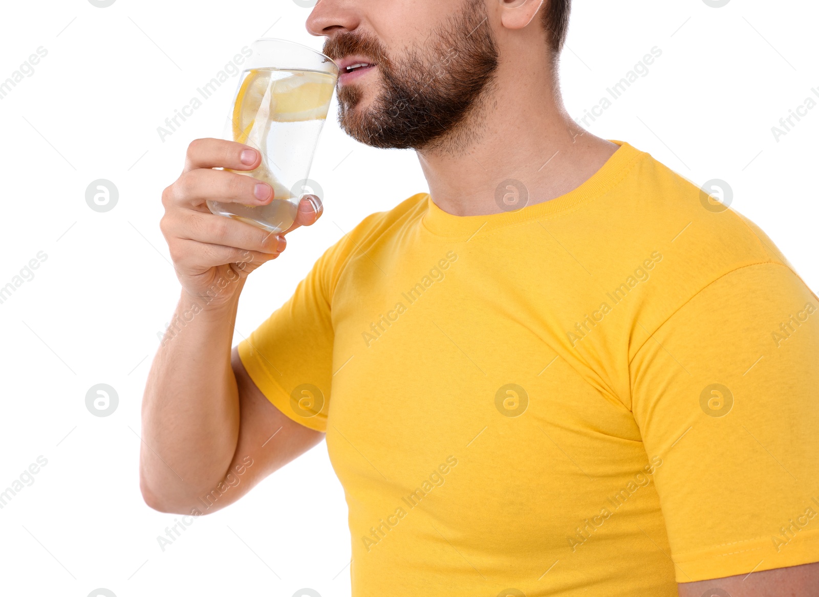 Photo of Man drinking water with lemon on white background, closeup