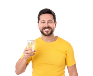 Photo of Happy man holding glass of water with lemon on white background