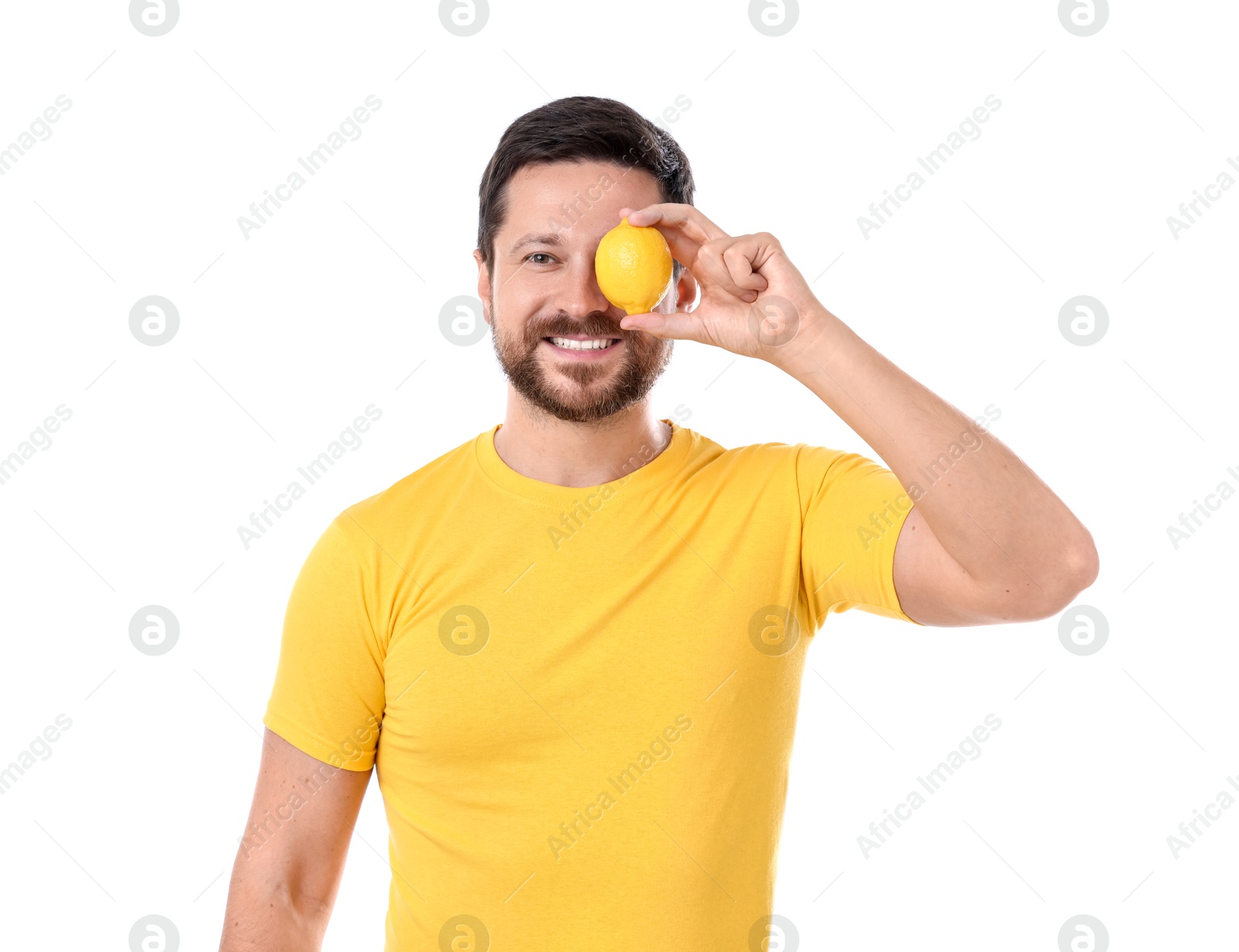 Photo of Happy man covering eye with lemon on white background