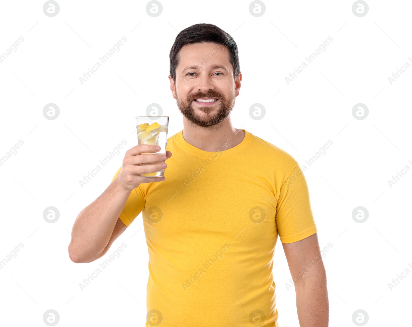 Photo of Happy man holding glass of water with lemon on white background