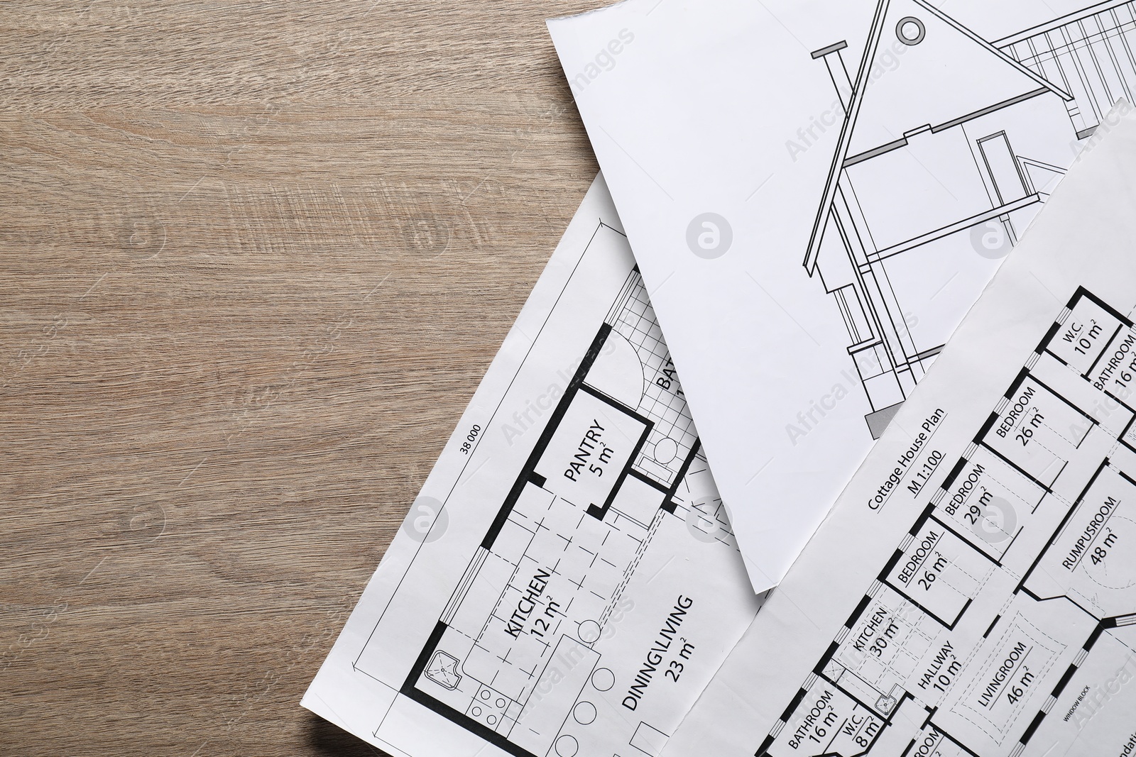 Photo of Different engineering drawings on wooden table, top view. Space for text