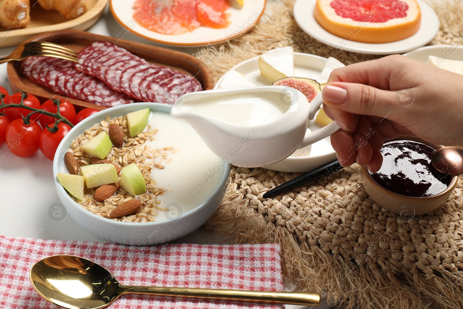 Photo of Woman having brunch at white table, closeup