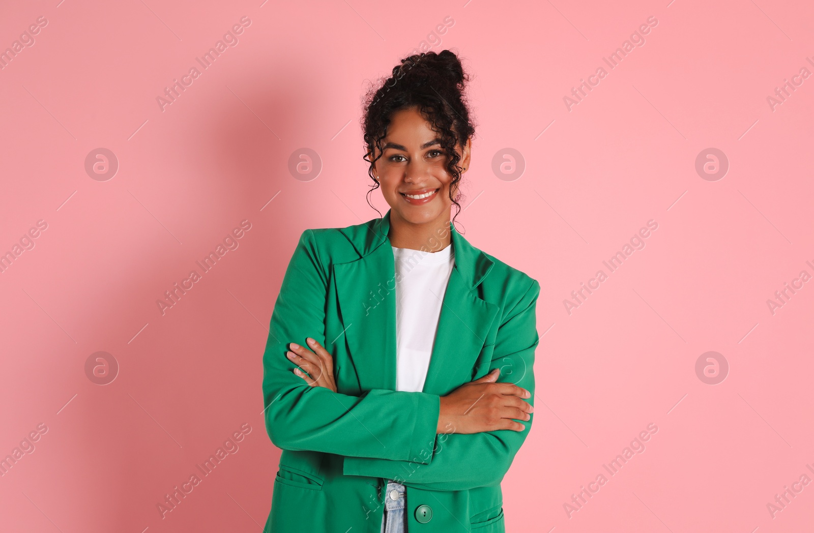 Photo of Beautiful woman in stylish jacket on pink background