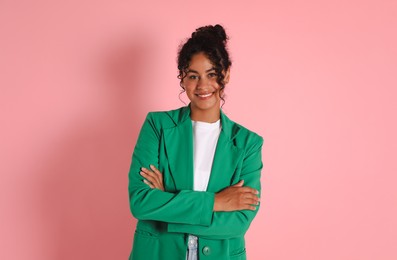 Photo of Beautiful woman in stylish jacket on pink background