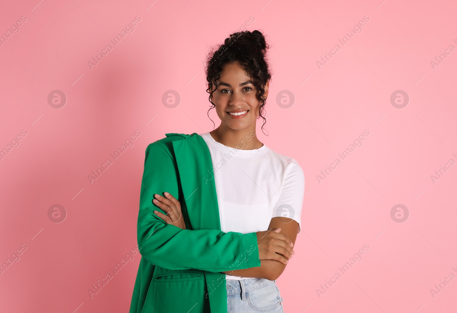 Photo of Beautiful woman with stylish jacket on pink background