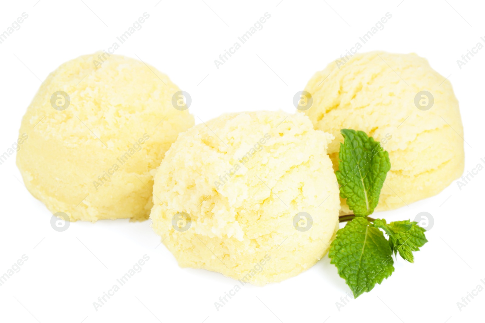 Photo of Scoops of melon sorbet and mint isolated on white