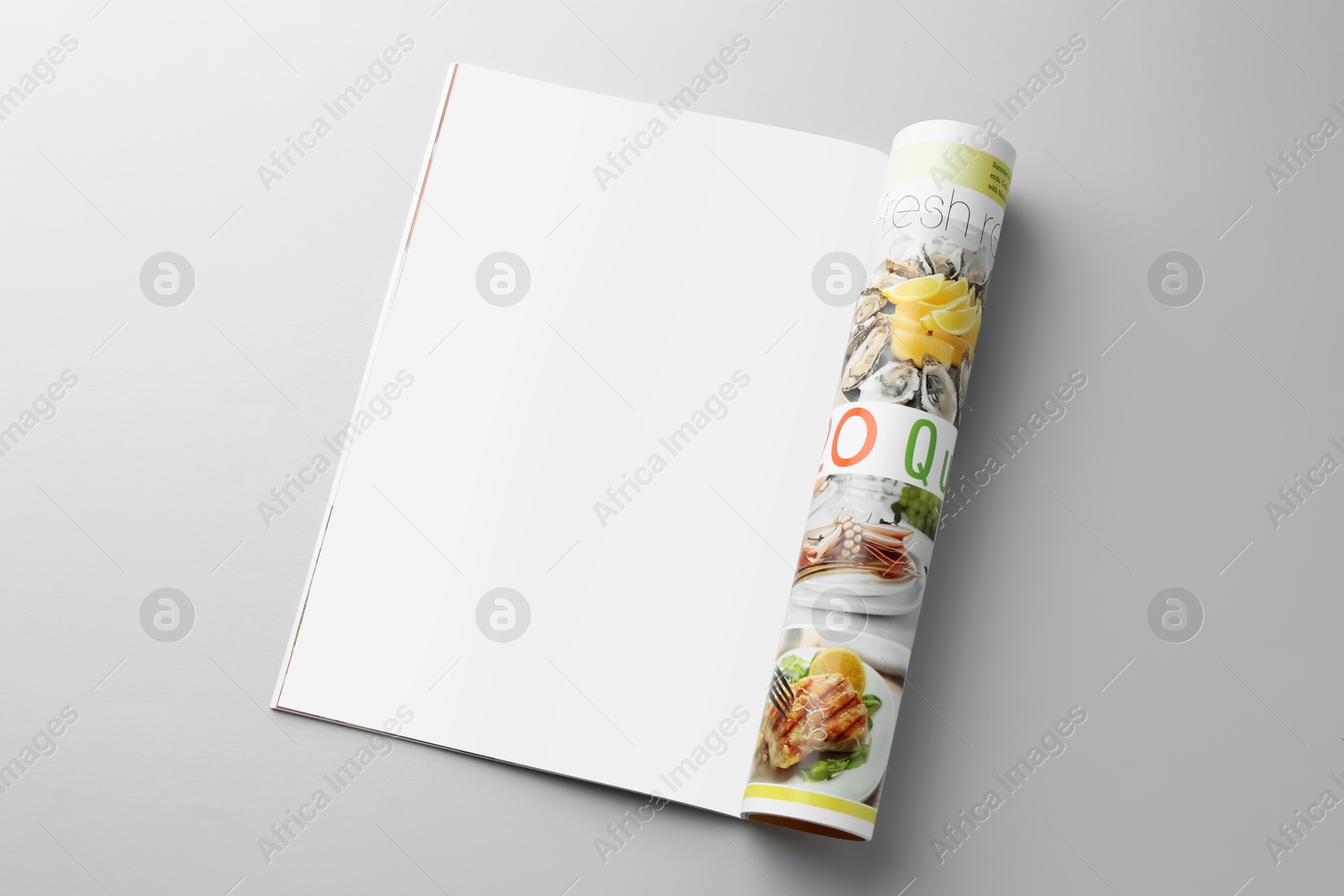 Photo of Open magazine on grey background. Mockup for design