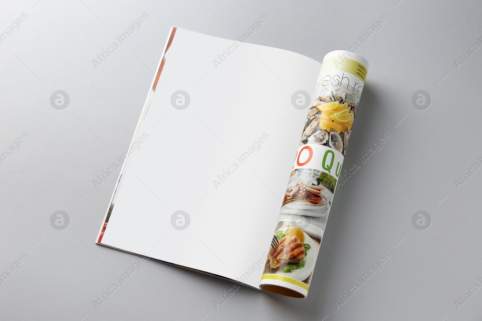 Photo of Open magazine on grey background. Mockup for design