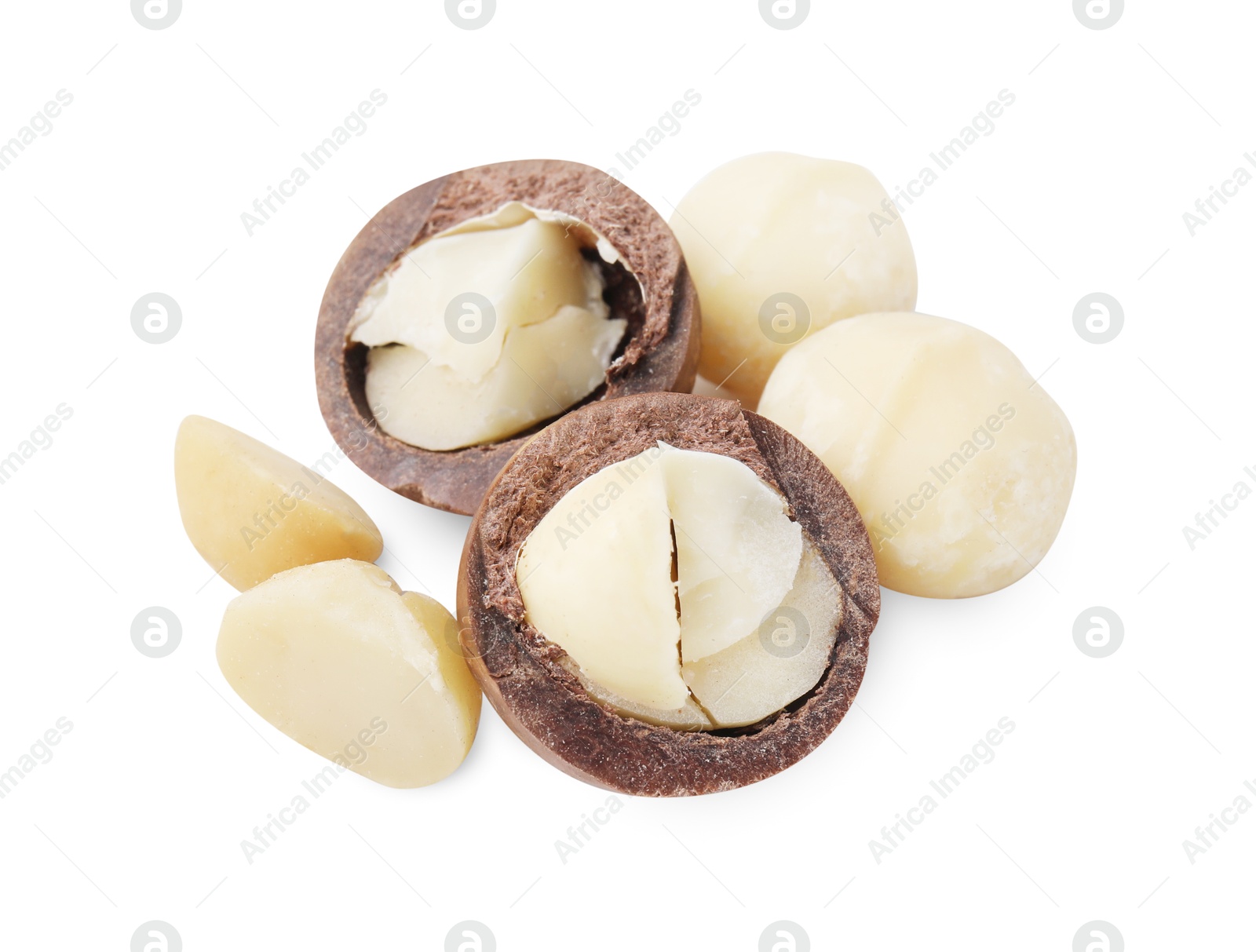 Photo of Macadamia nuts with shells isolated on white