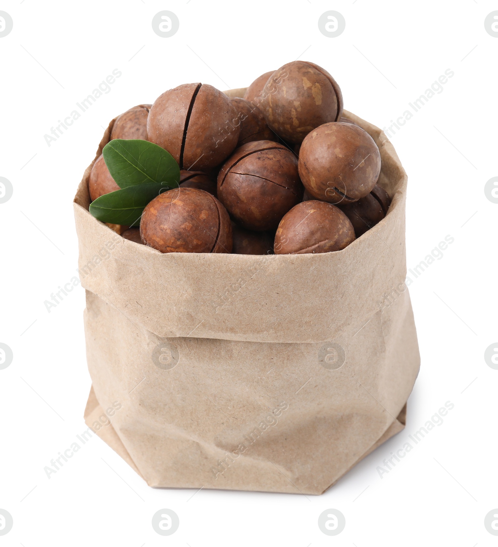 Photo of Macadamia nuts in paper bag isolated on white