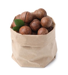 Macadamia nuts in paper bag isolated on white