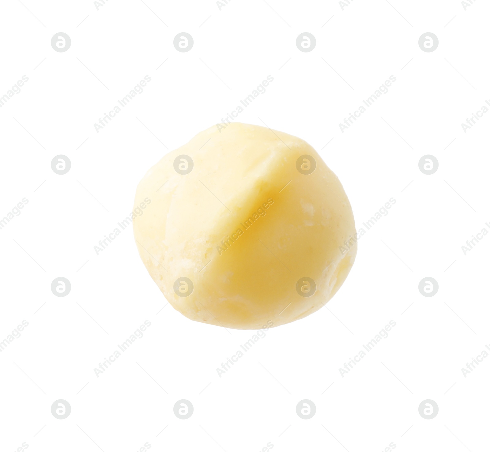 Photo of One peeled macadamia nut isolated on white