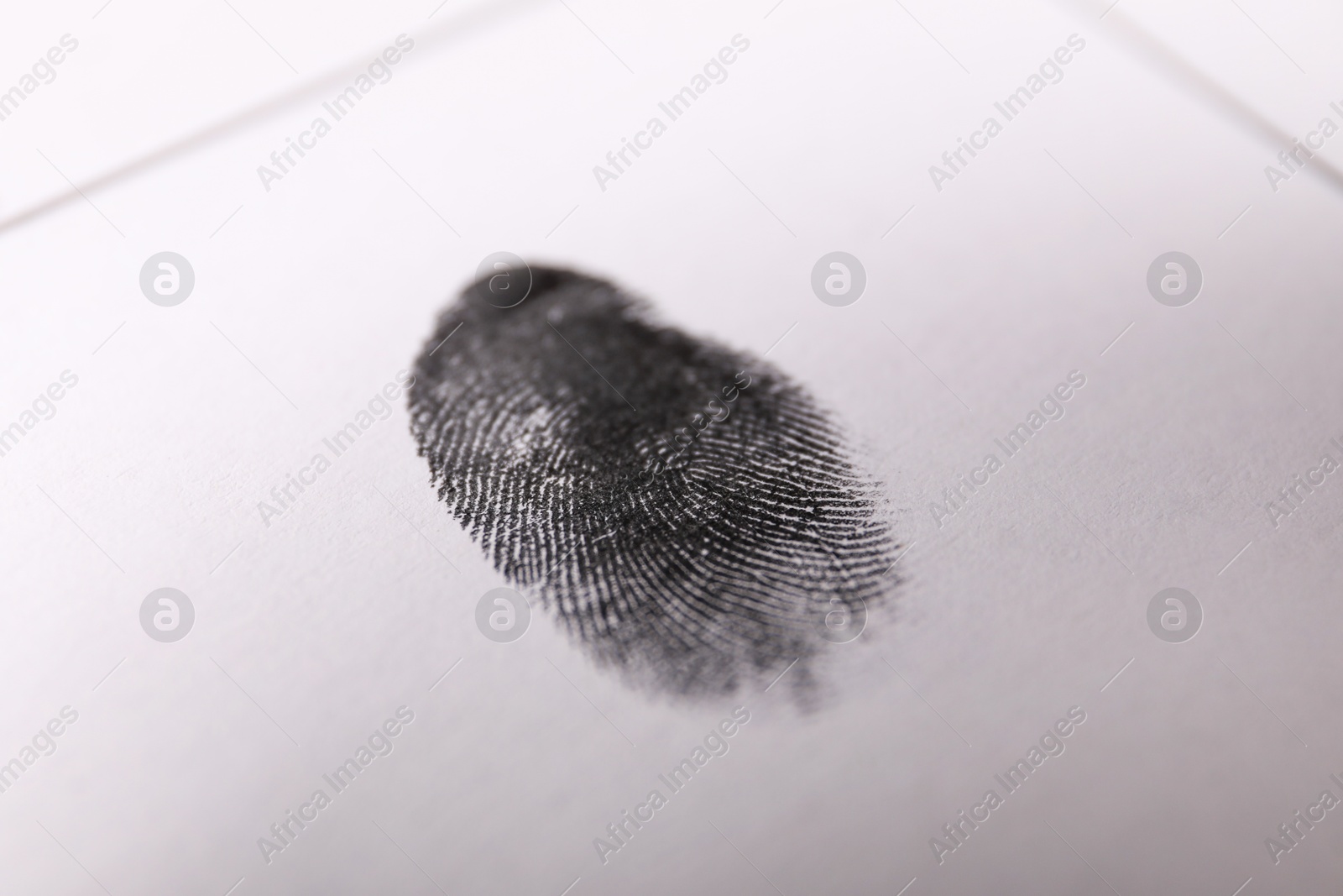 Photo of Human fingerprint on paper, closeup. Criminal conviction