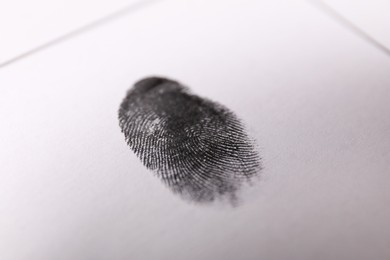 Human fingerprint on paper, closeup. Criminal conviction