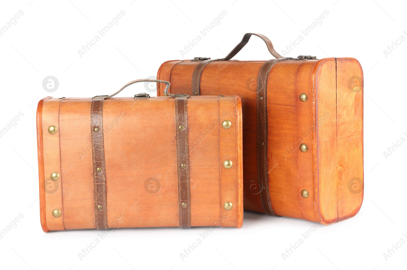 Photo of Two new wooden suitcases isolated on white