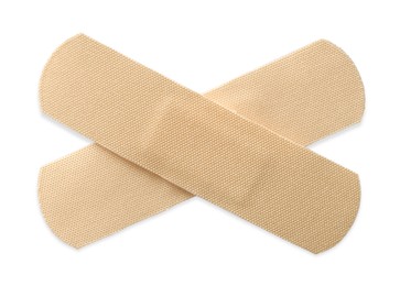 Photo of Medical adhesive bandages isolated on white, top view
