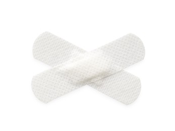 Photo of Medical adhesive bandages isolated on white, top view