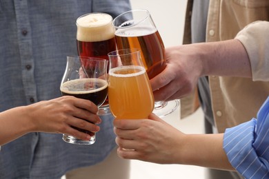 Photo of People with different types of beer clinking glasses, closeup