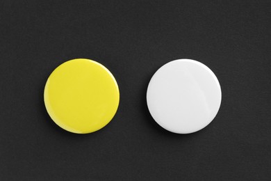 Photo of Button badges on black background, flat lay. Mockup for design