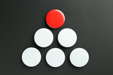 Photo of Button badges on black background, flat lay. Mockup for design