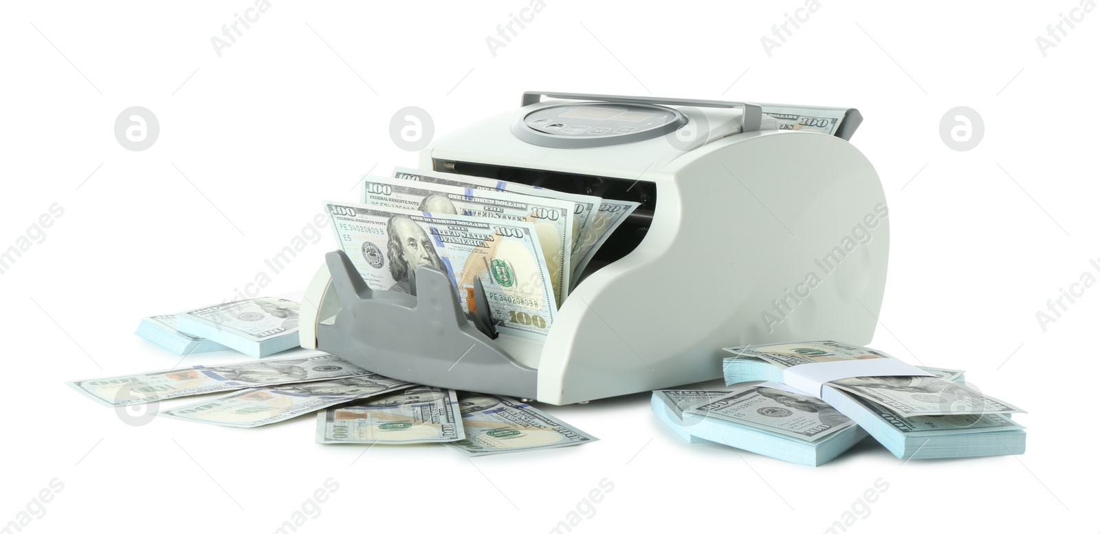 Photo of Money counter machine and dollar banknotes isolated on white