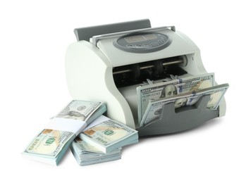 Money counter machine and dollar banknotes isolated on white