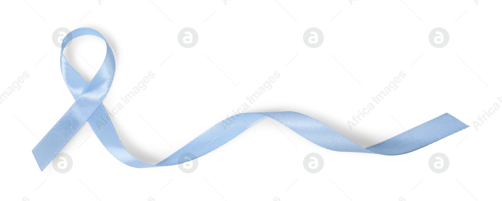 Photo of Light blue ribbon isolated on white, top view. Prostate cancer awareness