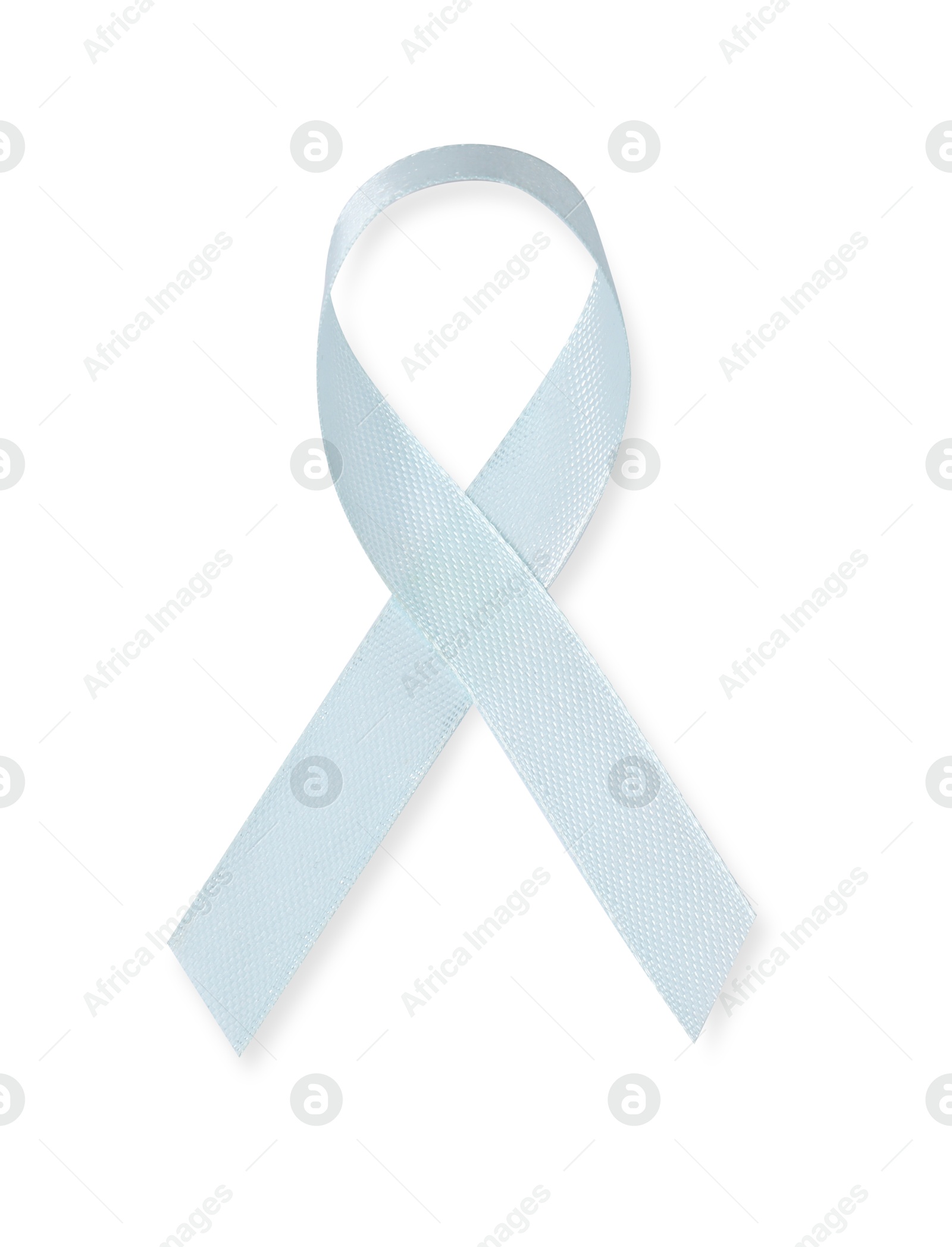 Photo of Light blue ribbon isolated on white, top view. Prostate cancer awareness