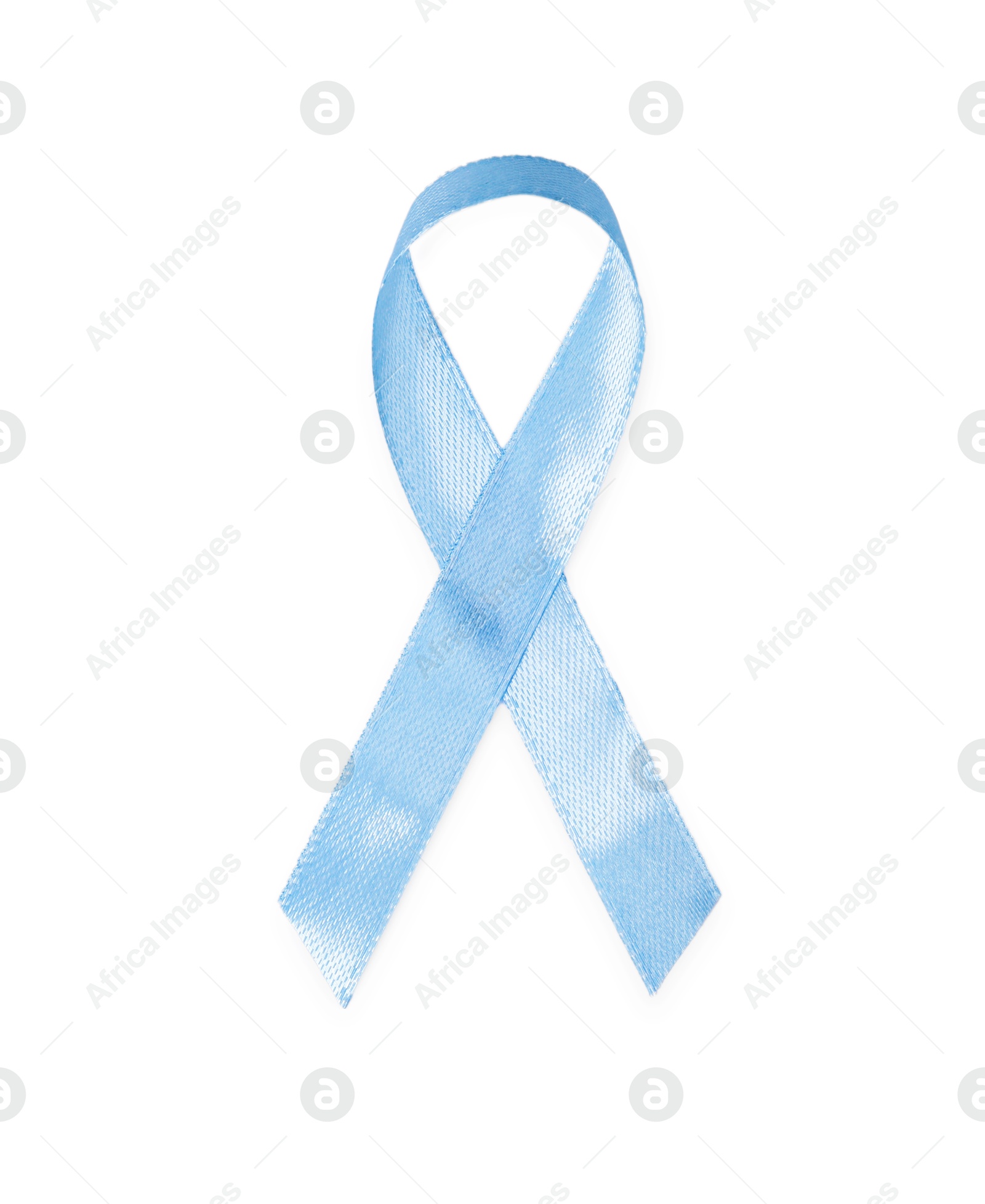 Photo of Light blue ribbon isolated on white, top view. Prostate cancer awareness