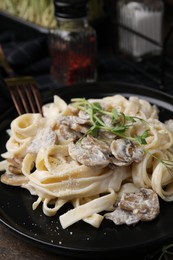 Photo of Delicious pasta with mushrooms on table, closeup