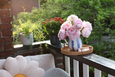 Photo of Balcony garden. Different plants growing on railings outdoors