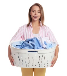 Happy young housewife with basket full of laundry on white background