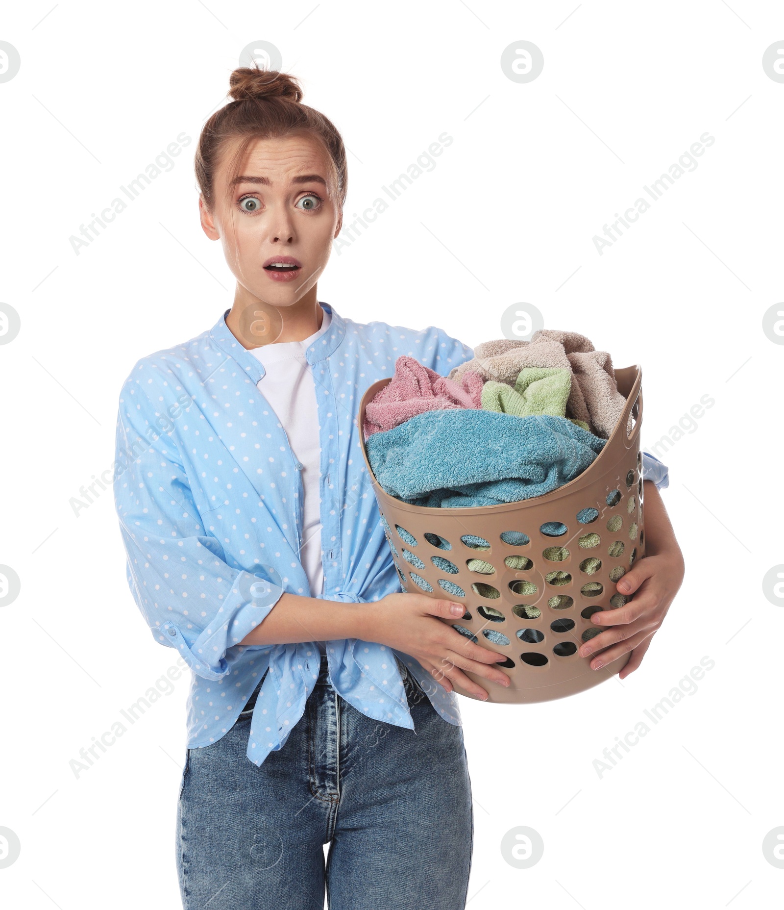 Photo of Tired housewife with basket full of laundry on white background