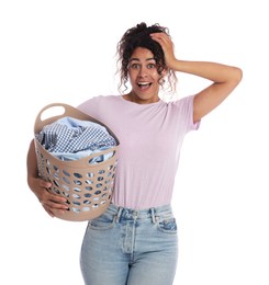 Emotional woman with basket full of laundry on white background